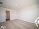 Bedroom with carpeting, door to bathroom, and neutral walls at 6105 Card Blvd, Indianapolis, IN 46221
