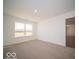 Bright bedroom with a large window and access to another room at 6105 Card Blvd, Indianapolis, IN 46221