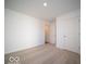 Bright bedroom with neutral walls and carpeted floors at 6105 Card Blvd, Indianapolis, IN 46221