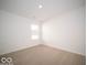 Spacious bedroom with neutral carpeting and large window at 6105 Card Blvd, Indianapolis, IN 46221