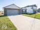Newly built home with a two-car garage and a spacious front yard at 6105 Card Blvd, Indianapolis, IN 46221