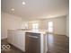 Kitchen island with sink, dishwasher, and ample counter space at 6105 Card Blvd, Indianapolis, IN 46221