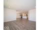 Open concept living room with vinyl flooring and kitchen views at 6105 Card Blvd, Indianapolis, IN 46221
