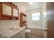 Bathroom with shower/tub combo and wood vanity at 216 E Elm St, Jamestown, IN 46147
