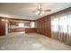 Open concept kitchen with wood cabinets and breakfast bar at 216 E Elm St, Jamestown, IN 46147