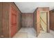 Room with wood paneling, carpet, and doors at 216 E Elm St, Jamestown, IN 46147