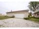 Detached single-car garage with gravel driveway at 216 E Elm St, Jamestown, IN 46147