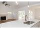 Modern kitchen with quartz countertops and a gold faucet at 4407 W Wandalee Ct, New Palestine, IN 46163