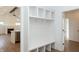White entryway with built-in bench seating and storage at 4407 W Wandalee Ct, New Palestine, IN 46163