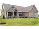 Two-story craftsman home with stone and blue siding at 4407 W Wandalee Ct, New Palestine, IN 46163