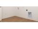 Laundry room with vinyl flooring and built-in shelving at 4407 W Wandalee Ct, New Palestine, IN 46163