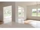 Sunlit dining area with hardwood floors and access to a sunroom at 4407 W Wandalee Ct, New Palestine, IN 46163