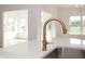 Modern kitchen with a gold gooseneck faucet and quartz countertop at 4407 W Wandalee Ct, New Palestine, IN 46163
