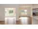 Sunlit dining area with hardwood floors and large windows at 4407 W Wandalee Ct, New Palestine, IN 46163