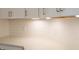 Kitchen boasts white cabinets and white subway tile backsplash at 4407 W Wandalee Ct, New Palestine, IN 46163
