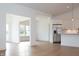 Bright dining area with hardwood floors and access to sunroom at 4407 W Wandalee Ct, New Palestine, IN 46163