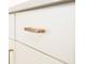 White kitchen cabinets with brushed gold hardware at 4407 W Wandalee Ct, New Palestine, IN 46163