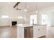 Open kitchen with island, stainless steel appliances, and white cabinets at 4407 W Wandalee Ct, New Palestine, IN 46163
