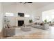 Spacious living room with fireplace and large windows at 4407 W Wandalee Ct, New Palestine, IN 46163