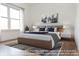 Primary bedroom with large bed and city view at 4407 W Wandalee Ct, New Palestine, IN 46163
