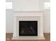 Modern fireplace with white mantel and quartz surround at 4407 W Wandalee Ct, New Palestine, IN 46163