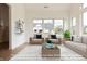 Bright living room with large windows and seating area at 4407 W Wandalee Ct, New Palestine, IN 46163