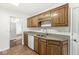 Kitchen features granite countertops and oak cabinets at 5445 Carnoustie Cir # 12A, Avon, IN 46123
