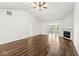 Living room with hardwood floors, vaulted ceiling, and fireplace at 5445 Carnoustie Cir # 12A, Avon, IN 46123