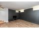 Finished basement room with TV stand and wood-look flooring at 108 E St Clair St # B, Indianapolis, IN 46204