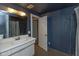 Bathroom with white vanity, and access to another room at 108 E St Clair St # B, Indianapolis, IN 46204
