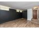 Finished basement with dark walls and wood-look flooring at 108 E St Clair St # B, Indianapolis, IN 46204