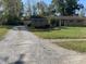 Ranch-style home with attached garage and landscaped yard at 647 W Mcgregor Rd, Indianapolis, IN 46217