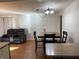 Dining area with wood table and hardwood floors at 647 W Mcgregor Rd, Indianapolis, IN 46217