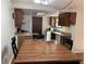 Kitchen with wood cabinets and a dining area at 647 W Mcgregor Rd, Indianapolis, IN 46217