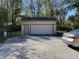 Detached garage with single door and double door at 647 W Mcgregor Rd, Indianapolis, IN 46217