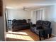 Living room with recliner sofas and hardwood floors at 647 W Mcgregor Rd, Indianapolis, IN 46217