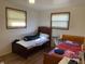 Bright bedroom with two beds and hardwood floors at 647 W Mcgregor Rd, Indianapolis, IN 46217
