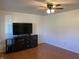 Living room featuring hardwood floors and a mounted TV at 647 W Mcgregor Rd, Indianapolis, IN 46217