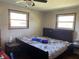 Spacious bedroom with two windows and hardwood floors at 647 W Mcgregor Rd, Indianapolis, IN 46217