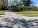 Ranch-style home with attached garage and landscaped yard at 647 W Mcgregor Rd, Indianapolis, IN 46217