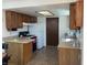 Kitchen offers wood cabinets and tiled floor at 647 W Mcgregor Rd, Indianapolis, IN 46217