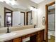 Double vanity bathroom with a large mirror and shower at 7178 Lockford N, Avon, IN 46123