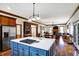 Open concept kitchen with island, stainless steel appliances, and hardwood floors at 7178 Lockford N, Avon, IN 46123