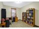 Home office with built-in shelving and hardwood floors at 7178 Lockford N, Avon, IN 46123