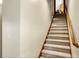 Carpeted staircase with wooden handrail leading to the upper level at 7178 Lockford N, Avon, IN 46123