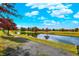 Peaceful community pond with scenic walking path and autumn foliage at 7178 Lockford N, Avon, IN 46123