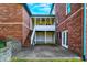 Brick home with a spacious back patio, screened porch, and stairs at 7178 Lockford N, Avon, IN 46123