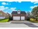 Detached two-car brick garage with white doors at 7178 Lockford N, Avon, IN 46123