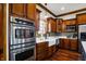 Kitchen with stainless steel appliances and a farmhouse sink at 7178 Lockford N, Avon, IN 46123