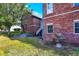 Brick home with a side yard, stone retaining wall, and fountain at 7178 Lockford N, Avon, IN 46123
